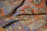 Distressed Oushak runner detail: worn pile with pale red, purple, blue geometric patterns.