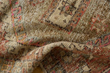 Distressed Oushak rug pile with even wear, revealing knot heads in blush and charcoal tones.