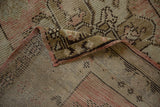 Vintage Distressed Oushak rug runner reverse, with painted numbers and worn dusty rose pile.