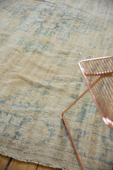 Distressed vintage Oushak carpet with worn knot heads, antique ivory and pale blue tones.