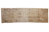 Distressed vintage Oushak runner with faded lilac and bronze single column medallions, 3' x 9'1