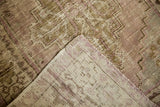 Distressed Oushak rug pile showing even wear to knot heads and foundation, pale lilac, beige.
