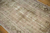 Distressed hand-knotted Oushak rug pile with pale lilac, antique ivory, and beige.