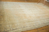 Decorative distressed Oushak rug showcasing light, time-softened tones and faded floral palmette motifs.