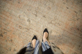 Vintage Distressed Oushak carpet showing faded peach-ivory texture and subtle outlined vinery.