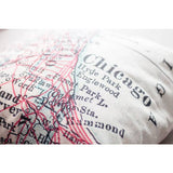 Textured linen cotton pillow close-up, vintage map detail of Chicago with red lines.