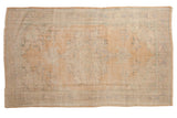 Faded distressed vintage Oushak rug, apricot and ivory, with blue-green medallion, 6x10.
