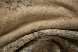 Distressed vintage Oushak rug's textured pile, revealing lazy lines and muted beige, blue, and mint tones.