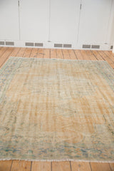 Distressed Oushak carpet pile, showing worn knot heads and visible foundation.