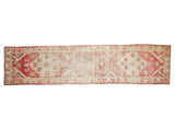 Vintage Distressed Oushak runner, triple medallion, pale raspberry red and antique ivory tones.