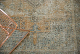 Decorative distressed Oushak rug with faded orange, oxidized silver, and antique ivory tones.