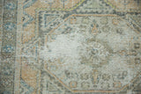 Close-up of vintage Oushak rug showing mostly even wear to knot heads and exposed foundation.
