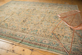 Distressed Turkish Oushak rug with intricate allover floral vinery in soft ivory and mint.