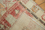Vintage Distressed Oushak rug reverse showing hand-knotted foundation and worn red border.