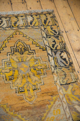 Vintage Distressed Oushak rug corner, saffron yellow floral border, serpent motif, abrash texture.