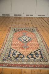 Antique Malayer corner: geometric borders, field motifs, even pile wear in navy, rust, beige.