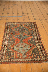 Vintage Kamseh rug's unusual reciprocating pawn border motif, with slate blue and madder root colors.