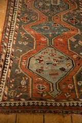 Detail of the Kamseh rug's inner border with reciprocating pawn motif and slate blue field.