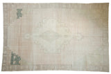 Distressed Oushak rug with muted beige, faded green highlights, and central medallion. 7'6
