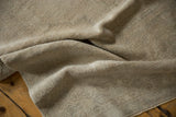 Low pile texture and soft, distressed ivory tones of the vintage Oushak rug runner.