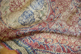 Evenly worn, hand-knotted texture of a distressed vintage rug showing the foundation.