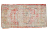 Distressed Oushak runner with an oversize faded cherry red, beige medallion, 2'3