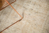 Hand-knotted distressed Oushak rug pile with even wear, beige and ivory tones.