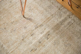 Distressed texture and even wear of vintage Oushak rug pile in neutral beige, sand, ivory.