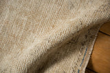 Distressed vintage Oushak rug reverse, showing textured hand-knotted foundation.