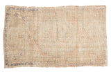 Distressed Oushak rug features faded medallion in blush, ivory, blue, 2'11