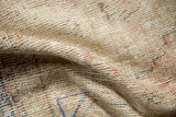Vintage distressed Oushak rug's worn pile showcasing beige, pale blush, and subtle cobalt blue.