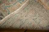 Tightly woven hand-knotted foundation and secured side edge of a vintage Oushak rug.