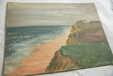 Angled view of the vintage Cape Cod seascape painting showing textured canvas and muted tones.