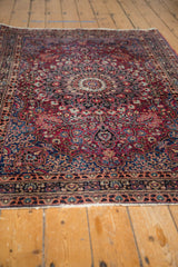 Hand-knotted Meshed rug with roundel medallion, intricate floral vinery, and soft pile.