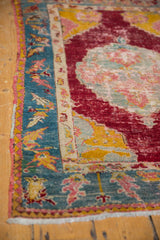 Intact polychrome selvage and aqua blue floral border on a circa 1910s Anatolian rug.