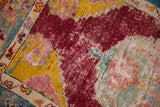 Mostly even wear across the hand-knotted pile revealing the rug's foundation.