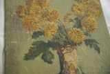 Detail of textured impasto mustard yellow Fall flowers on vintage painting.