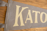 Angled close-up of the cream lettering and soft texture of a gray wool felt pennant.