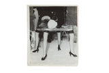 Surrealist movie still photograph from Hitchcock's Spellbound showing a Dali-designed table with legs.