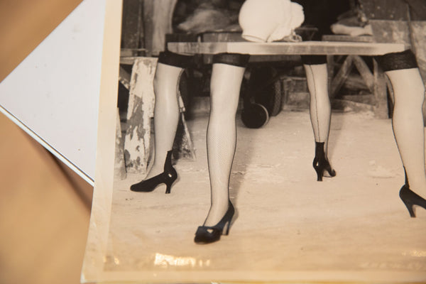 Angled detail of the vintage Hitchcock Spellbound photo showing its aged paper and surreal imagery.