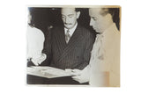 Original black and white photograph of Salvador Dali reviewing Hitchcock film designs.