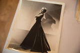 The vintage Carole Lombard photograph shown at an angle to display its physical condition.