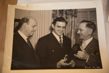 Vintage black and white photo of David Selznick accepting plaque, showing wear.