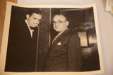 Vintage photograph of David O. Selznick with cigarette and Myron Selznick in glasses.