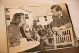 Vintage candid photograph showing a man in glasses conversing with Ingrid Bergman.