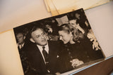 Angled view of the physical vintage photograph of Ingrid Bergman placed within a photo album.
