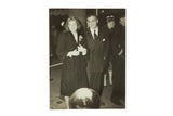 Vintage black and white photograph of Ingrid Bergman in textured coat beside David Selznick.