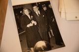 Aged sepia photograph of Ingrid Bergman smiling in a coat with David Selznick.