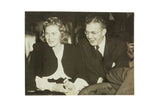 Vintage candid photograph of actress Ingrid Bergman smiling beside a laughing David Selznick.