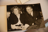 Angled view of the vintage candid photograph featuring Ingrid Bergman and a laughing David Selznick.
